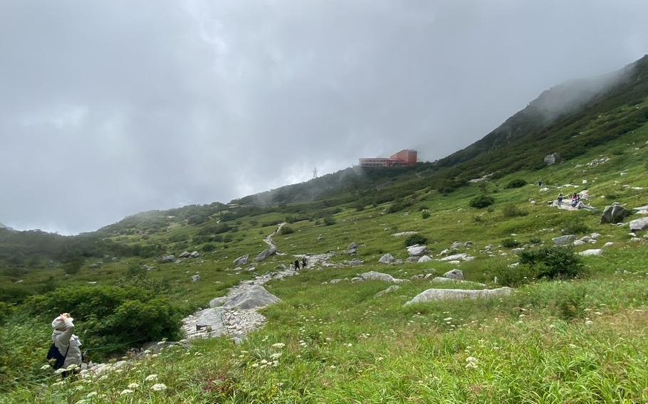 Climbers are walking in the path of Senjojiki Cirque.